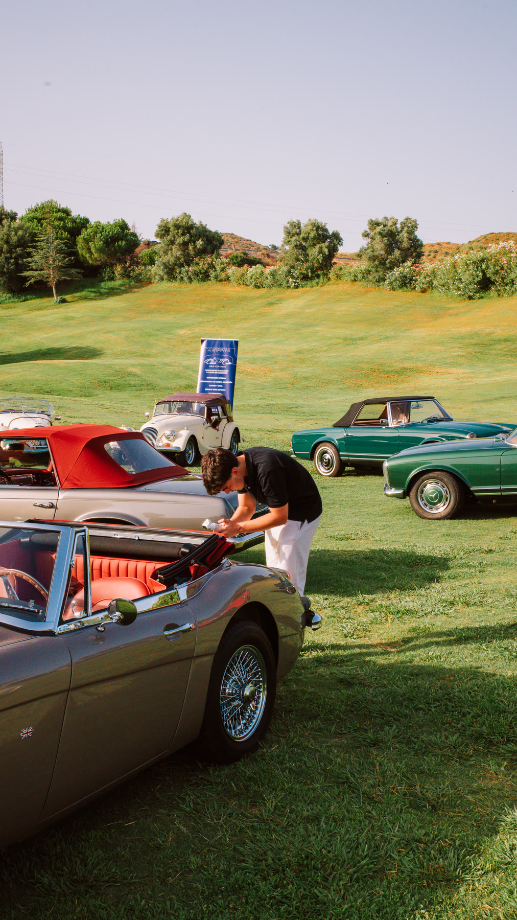 Julio Bernabéu working among classic cars at an event